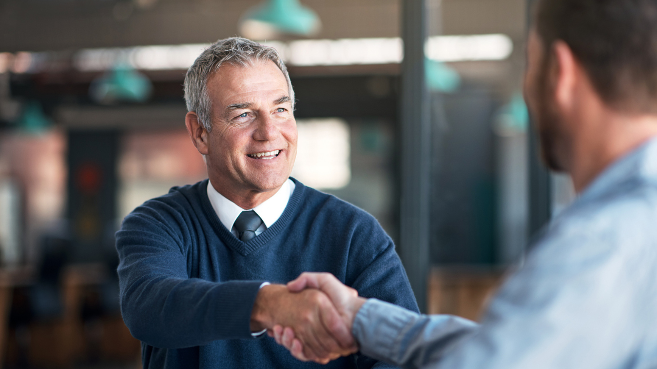 Professional handshake after successful career meeting