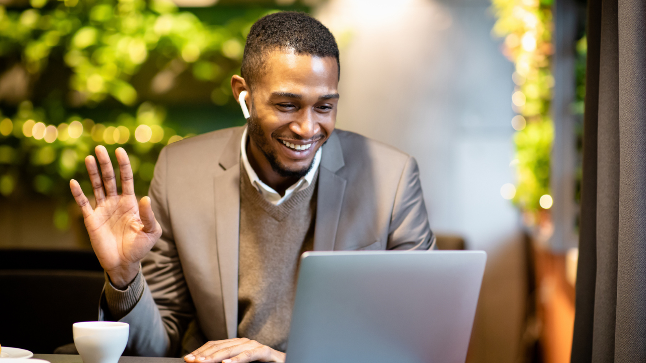 Professional attending virtual career coaching session on laptop